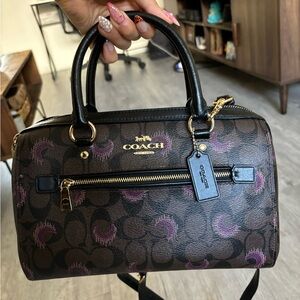 Brown coach purse with purple moons